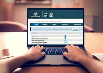 Image of a person accessing the WELS registration database from a laptop.