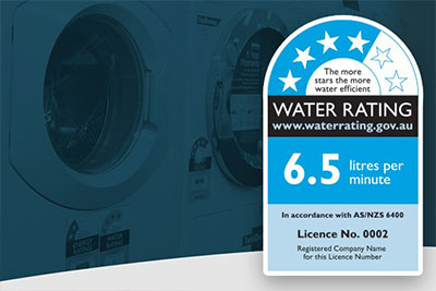 An image of a water rating label with the star rating and litres per minute values in front of a set of front loader clothes washing machines.
